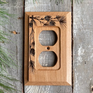 Wooden single outlet wall plate cover with wood burned pine & cones