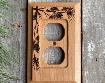 Wooden single outlet wall plate cover with wood burned pine & cones