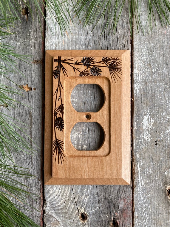 Wooden single outlet wall plate cover with wood burned pine & cones