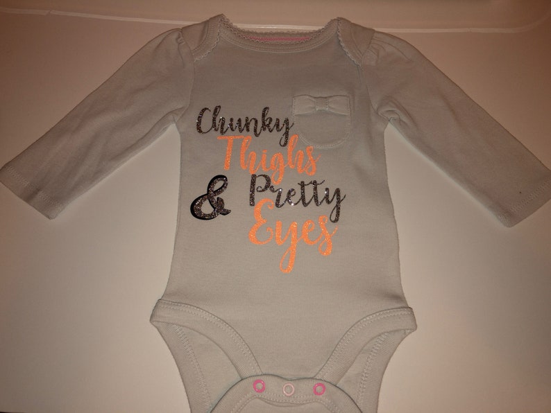 Chunky thighs and pretty eyes onsie