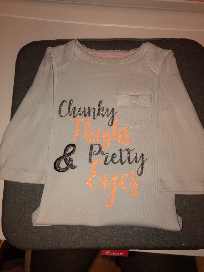 Chunky thighs and pretty eyes onsie