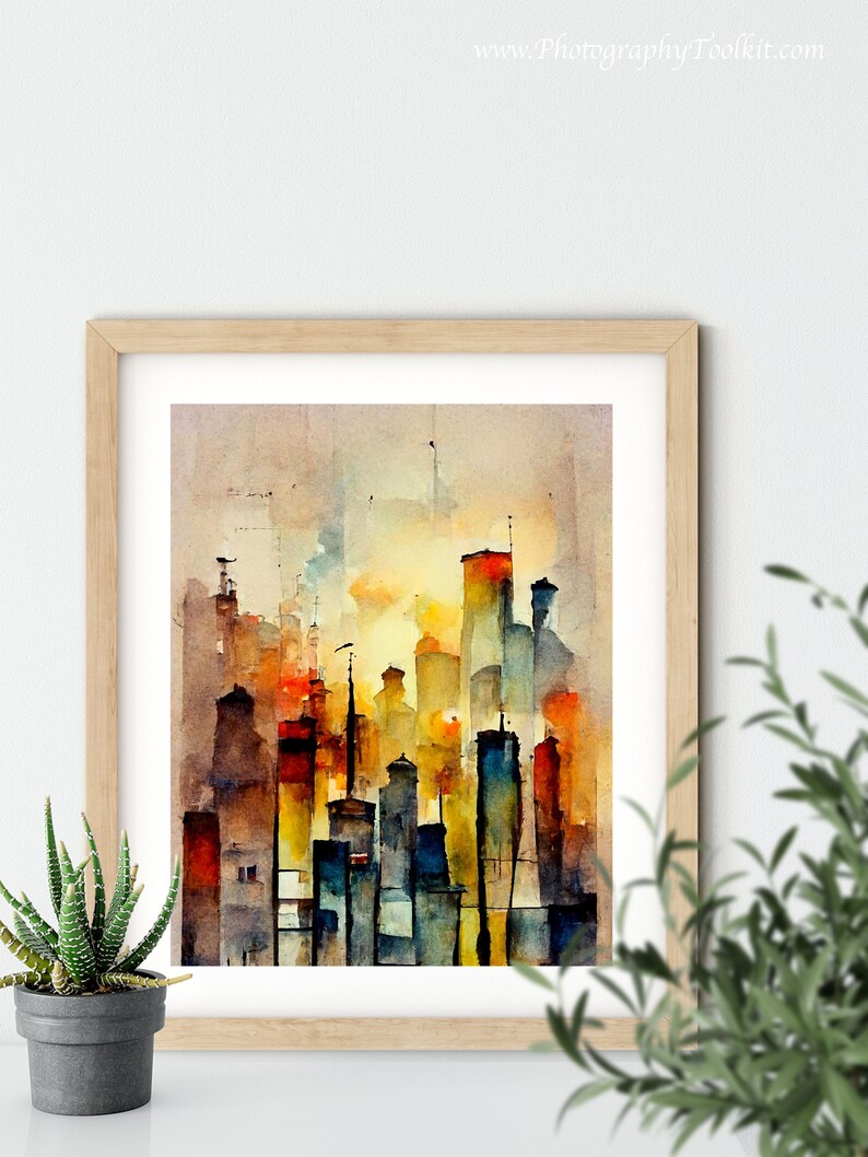 May include: A watercolor painting of a city skyline with tall buildings in shades of orange, yellow, blue, and brown. The buildings are painted in a loose, impressionistic style, with soft edges and flowing lines. The painting is framed in a light wood frame.