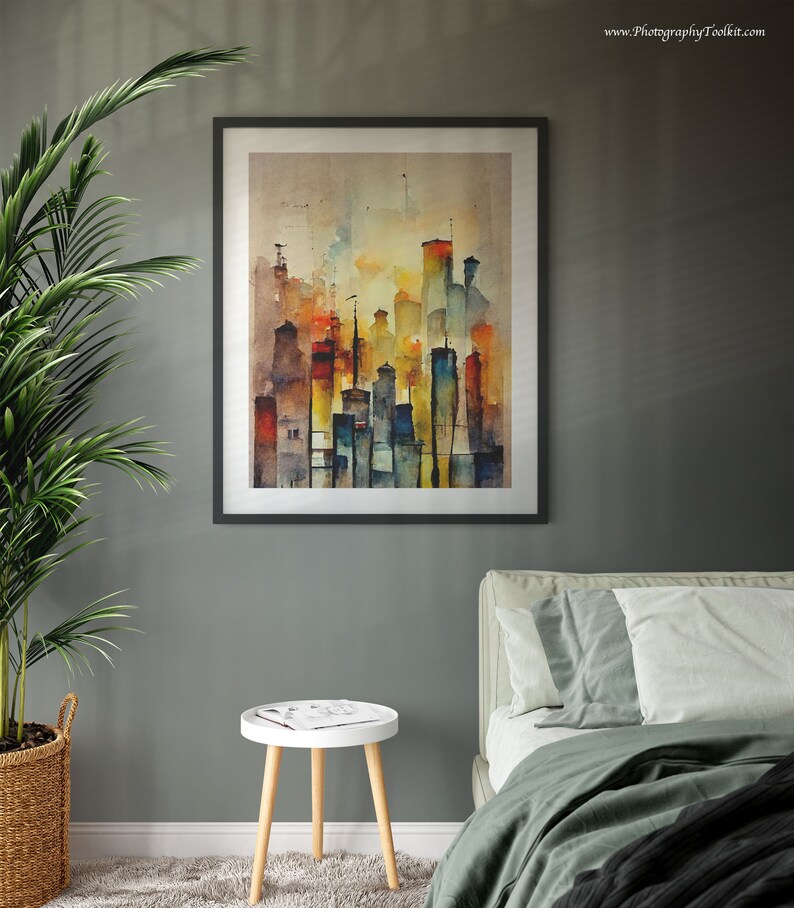 May include: A framed watercolor painting of a city skyline with tall buildings in shades of yellow, orange, red, blue, and green. The buildings are depicted against a light brown background with a hazy, atmospheric effect.