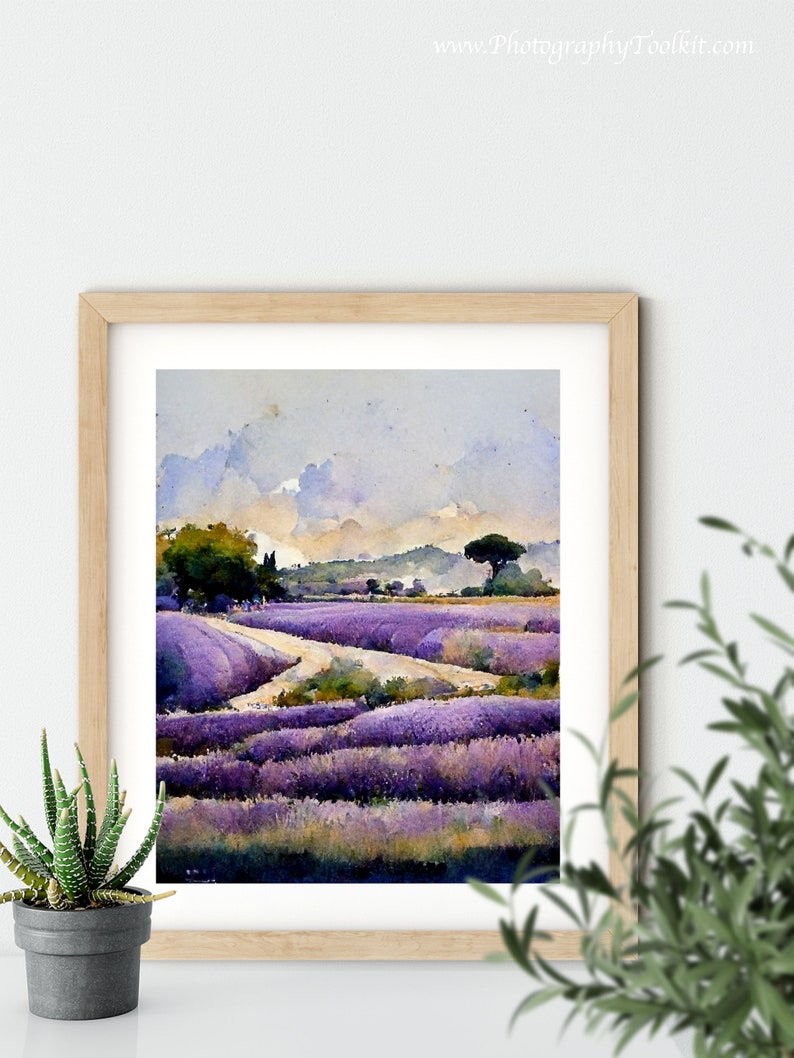 May include: A watercolor painting of a lavender field with a dirt road winding through it. The sky is a light blue with white clouds. There is a small tree on the right side of the painting.