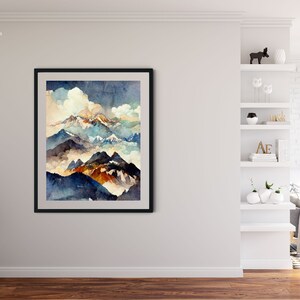 May include: A framed watercolor painting of a mountain range with a cloudy sky. The mountains are painted in shades of blue, green, and brown. The sky is a light blue with white clouds.
