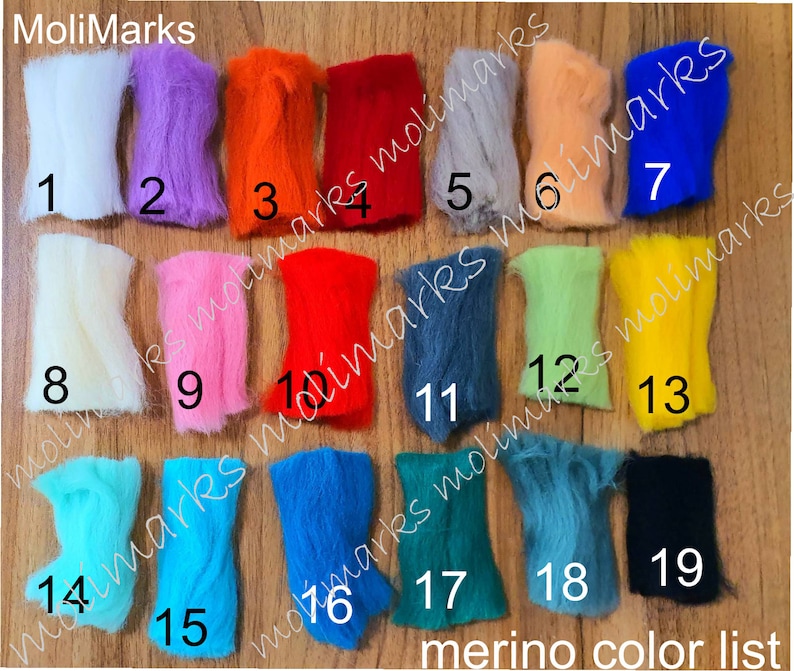 May include: A colour chart of 19 different shades of merino wool. The wool is arranged in rows of three, with each shade numbered from 1 to 19. The chart is labelled "merino colour list".