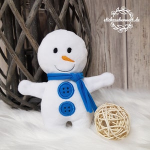 May include: White plush snowman with a blue scarf and two black buttons. The snowman has a carrot nose and a stitched smile.