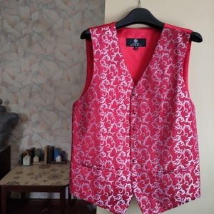 Red jacquard vest boasts with silver embroidery by Alexander Dobel small size