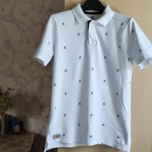 Cotton white skull print womens short sleeve polo t-shirt byAbercrombie small size