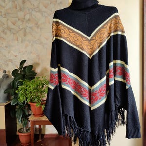 Vintage 90s wool poncho sweater black with colourful ethnic pattern long sleeve and fringe one size
