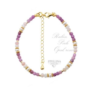 May include: A gold bracelet with a mix of pink and purple beads, and small white pearls. The bracelet has a gold clasp and an adjustable chain. The text "Rubin Perle Opal rosa" is visible.