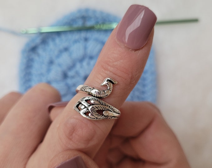 Peacock crochet or knitting ring a yarn tension aid for crocheting and knitting. This is a right-handed crochet/knitting ring.