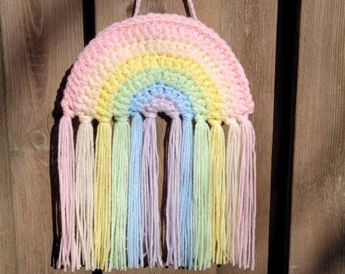 Crocheted Rainbow pendant in pastel colours.