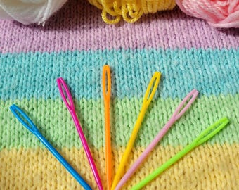 Set of 6 plastic sewing needles. Embroidery needles in cheerful colors. Sewing needles with a large eye.