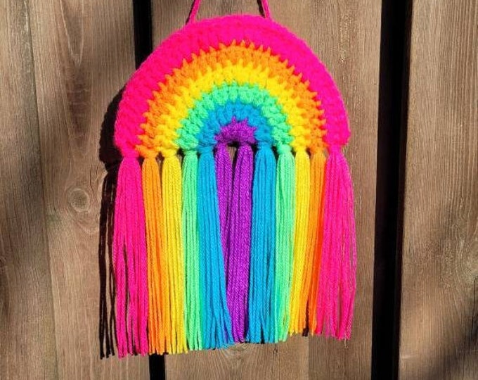 Crocheted rainbow pendant.