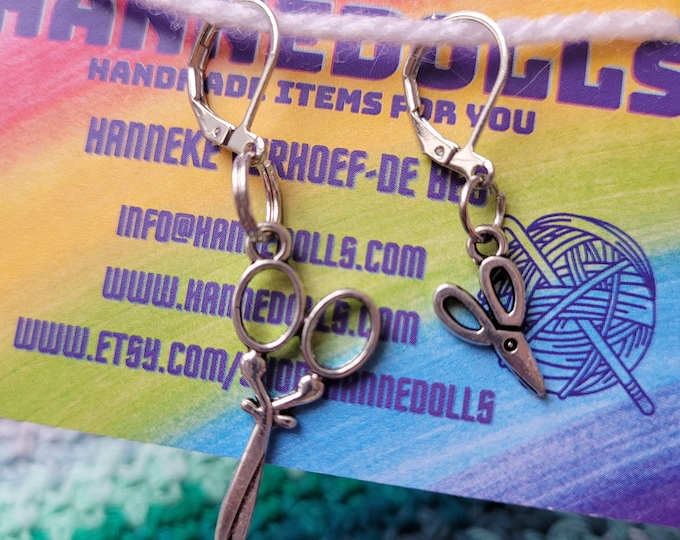 Stitch markers large and small scissors. these stitch markers are sold individually