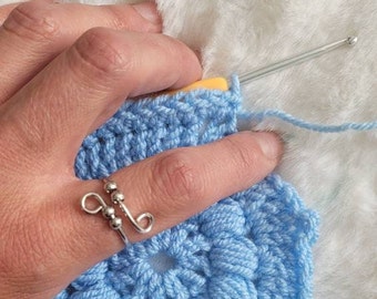 Colored Peacock crochet or knitting ring, a yarn tension aid for crocheting  and knitting