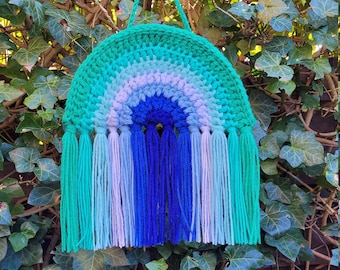 Crocheted rainbow pendant in the colours of the gay flag.