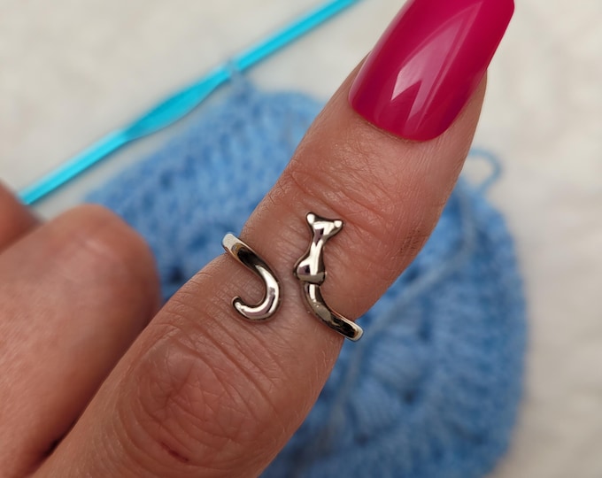 A cat crochet or knitting ring is a yarn tension aid for crocheting or knitting. This is a right-handed crochet or knitting ring.