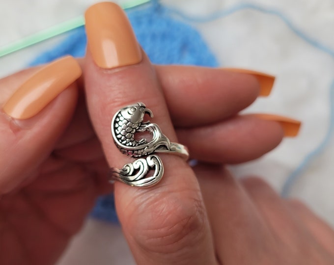 Fish hook or knit ring a yarn tension aid for crocheting and knitting. This is a right-handed hook/knitting ring.