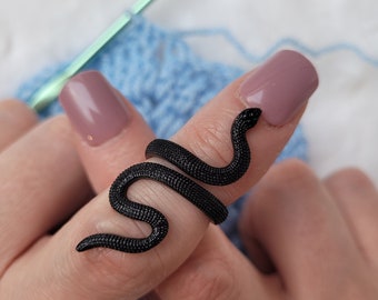 A worked snake crochet or knitting ring, a yarn tension aid for crocheting and knitting.