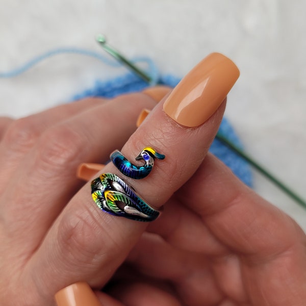 Colored Peacock crochet or knitting ring, a yarn tension aid for crocheting and knitting