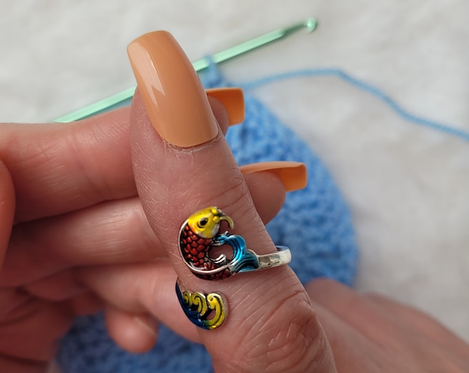 Colored fish hook or knit ring a yarn tension aid for crocheting and knitting. This is a right-handed hook/knitting ring.