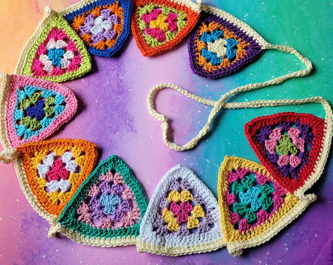 Crocheted garland with 10 granny square flags