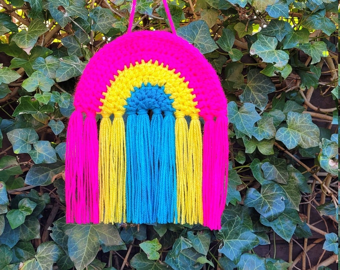 Crocheted rainbow pendant in the colors of the pansexual flag