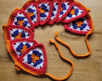 Crocheted garland with 10 granny square flags.