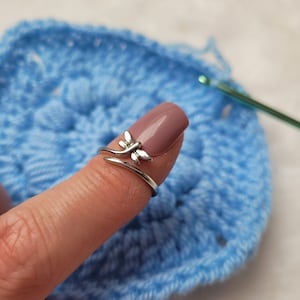 Libelle crochet or knitting ring is a yarn tension aid for crocheting and knitting.