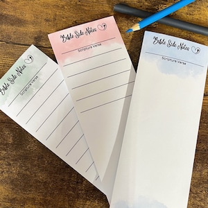 May include: Three blank notepads with watercolor backgrounds in pink, blue, and green. Each notepad has the text "Bible Side Notes" and "Scripture Verse" printed on the top.