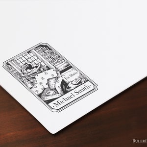 May include: Black and white illustration of a book-filled room with a globe, books, and a chair. The text "Ex Libris" and ".Michael Smith." are included in the image.