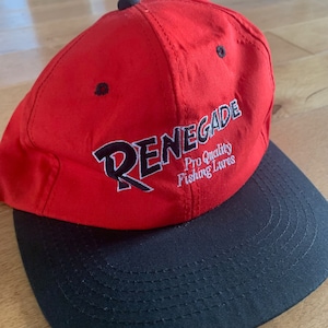 May include: Red and black baseball cap with the text "RENEGADE Pro Quality Fishing Lures" embroidered on the front.