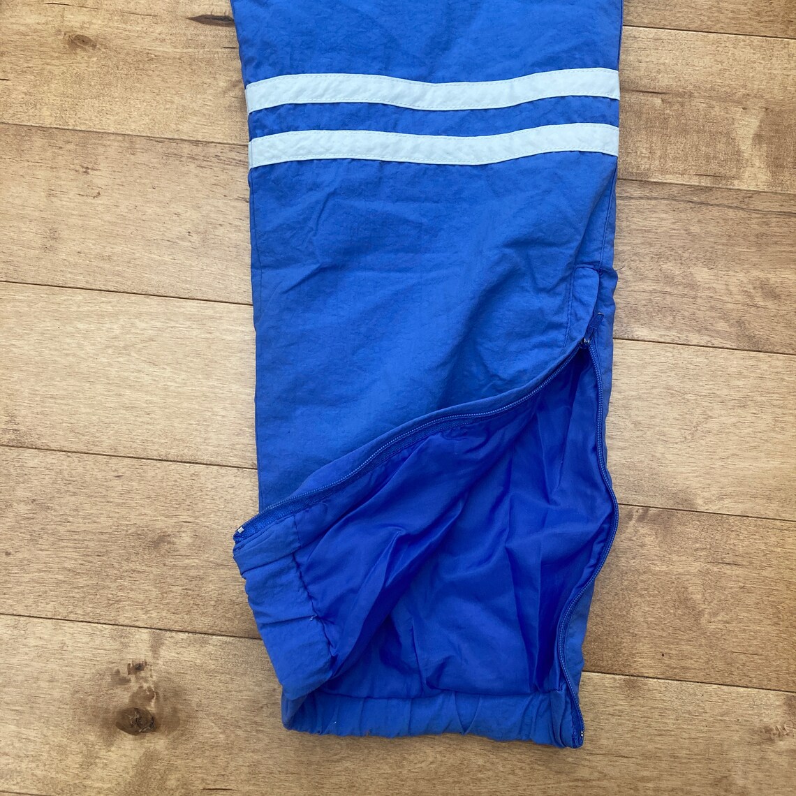 purple adidas track pants