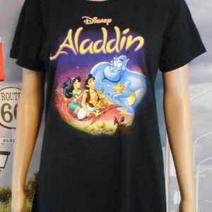 キッズ古着 vintage Disney Aladdin jasmine Tee Vintage Disney Aladdin Jasmine T Shirt Donn Kenny All Over