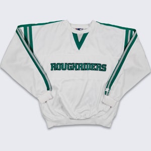 May include: White sweatshirt with green and silver stripes on the sleeves and shoulders. The word "ROUGHRIDERS" is embroidered across the chest in green. It has a V-neck collar and ribbed cuffs.