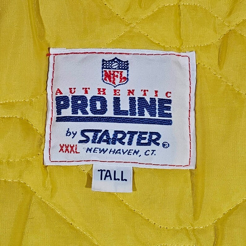 May include: White tag with blue and red stitching, featuring the NFL logo and the text "Authentic Pro Line by Starter&reg; XXL New Haven, CT. Tall".