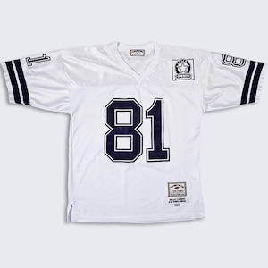 May include: White football jersey with blue and black trim. The jersey has the number "81" on the front and a Dallas Cowboys patch on the chest. The jersey is made by "The Century" brand.