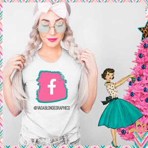 May include: White t-shirt with a pink and teal graphic of the Facebook 'f' logo. The text '@vagablondegraphics' is below the graphic.