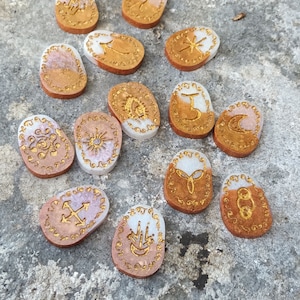 Pearly brown and white Wiccan runes, witch runes, esotericism