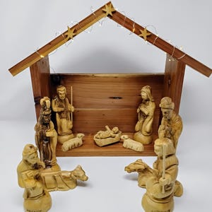 Bethlehem olive wood detail carving style nativity set with cedar wood Stable Manger LED lights engraved figures with Bethlehem jerusalem