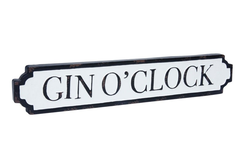 May include: A white sign with black lettering that reads "GIN O'CLOCK" on a black background. The sign is shaped like a street sign and has a distressed look.