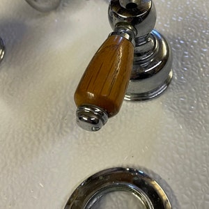 Classic chrome lever facet with wood handles.