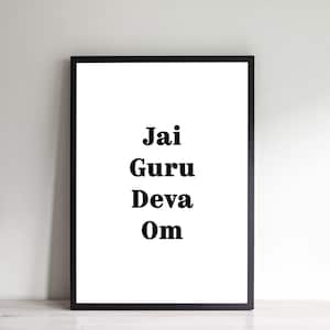 May include: A black framed print with the words "Jai Guru Deva Om" in bold black font.