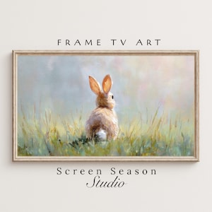 Könnte beinhalten: Ein gerahmter digitaler Kunstdruck mit einem Hasen in einem Grasfeld. Das Kunstwerk hat eine weiche Pastellfarbpalette. Der Text "FRAME TV ART" steht oben und "Screen Season Studio" unten.