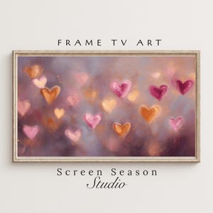 May include: Framed TV art featuring a romantic design of floating hearts in shades of pink, orange, and gold against a soft, blurred background. The text "FRAME TV ART" and "Screen Season Studio" are displayed on the image.