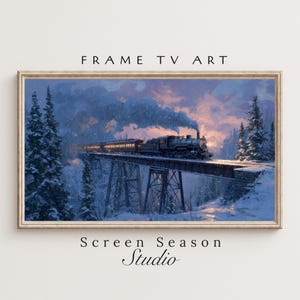 May include: Framed art print of a vintage train crossing a snowy bridge, with evergreen trees and a sunset in the background. The text "FRAME TV ART" is at the top, and "Screen Season Studio" is at the bottom.