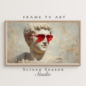 Könnte beinhalten: Gerahmter Kunstdruck mit einer klassischen Büste, die eine rote herzförmige Sonnenbrille trägt. Das Kunstwerk hat eine Vintage-Ästhetik mit dem Text "FRAME TV ART" oben und "Screen Season Studio" unten.
