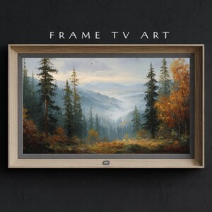 Könnte beinhalten: Ein gerahmtes Landschaftsgemälde mit einer Waldszene. Das Kunstwerk zeigt hohe immergrüne Bäume, herbstliches Laub und ein nebliges Tal. Der Rahmen ist aus hellem Holz, und der Text "FRAME TV ART" befindet sich oben.